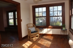 Sun-drenched room w/ lots of windows; great as family room, home office, den