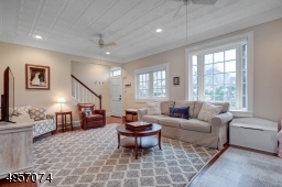 Sun-drenched living room with high ceilings
