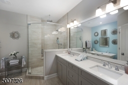 Beautifully coordinated with with the master bedroom. The bathroom also was upgraded to Quartz counter tops.