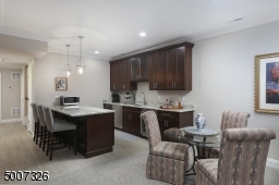 Great for entertaining, we have added the upper cabinets, sink and a wine refrigerator.