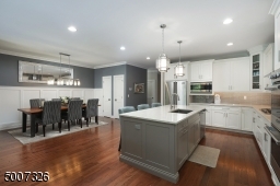 Quartz counter tops, under cabinet lighting and I love the glass backsplash!