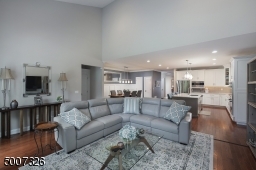 Complete with custom drapes and Hunter Douglas Glider Silhouette window treatments.