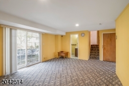 Powder Room, Sliders to Patio, and Garage access