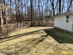 Property is 300 feet deep, extending beyond fence and brook