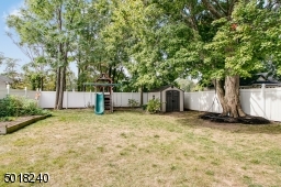 Raised garden beds, playset, shed and tree swing