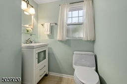 This powder room can be expanded to a full bath. There is an unfinished area with a sink on the other side of the wall where you could put a shower instead.
