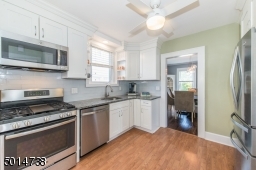 updated stainless steel appliances make this kitchen a pleasure to cook in