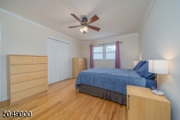 Overhead lighting and ceiling fan, plus double closets