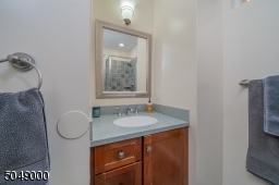1 of 3 full baths, this one with stall shower