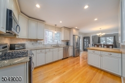 Large kitchen with generous cabinet space; open layout perfect for entertaining