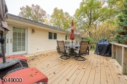 Easy to maintain TREX deck off the kitchen; enjoy al fresco dining in your private backyard