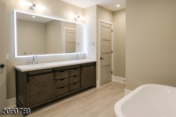 Double vanity with anti-fog infrared mirror, linen storage closet