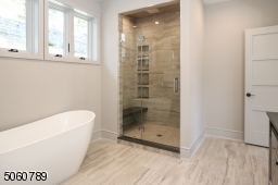 Separate tub, oversized shower, commode room, and heated floors