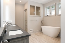 Double vanity with anti-fog infrared mirror, linen storage closet