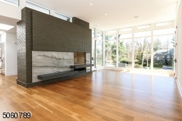 Floor to ceiling Anderson 400 Series Windows, original fireplace has been completely refurbished, repointed and painted with new granite floating bench.