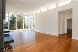 6" White Oak wood flooring throughout, opens to Master Suite 1