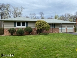 Expansive front lawn 2 car garage