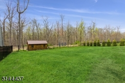 Level, fenced in backyard back to Watchung Reservation
