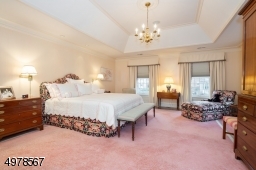 Beautiful tray ceiling defines this lare 20x16 room.  Windows overlook the beautiful courtyard.  Connected are two large closets, linen closet and master bath