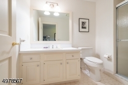 This bathroom is directly connected to the home office / bedroom