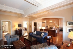 Note bright connections to other rooms highlighted by dramatic woodwork details Kitchen and wine bar nearby gathering area.