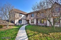 Wrapped around lovely level grounds. Pool/Tennis Ct for residents.