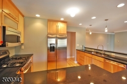 Tons of cabinetry, double sinks, wine refrigerator and great stainless steel appliances.