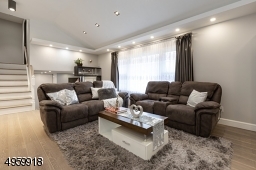 with high ceiling, recess lighting,build in  speakers and wired for electric blinds/shades