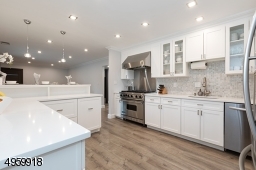 with white quartz  countertops, SS appl