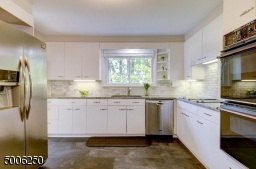 Enjoy granite counter tops, attractive tiled backsplash, stainless steel refrig, double wall oven and electric cooktop.
