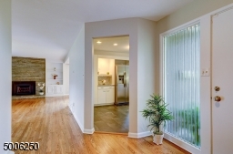 Features wood floor and guest closet.