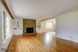 Attractive gas stone Fireplace and built-in cabinetry.