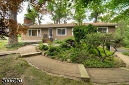 Winding paver walkway leads you from the driveway to the back patio area and entrance to the home.