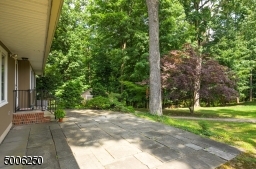 Overlooks a parklike one-acre property in bucolic setting