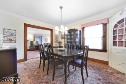 Formal dining room with built-in corner china cabinet - perfect for entertaining with great flow from kitchen and living room