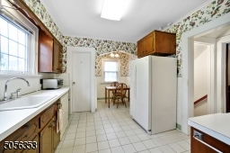 Kitchen with breakfast nook and powder room