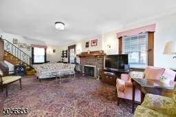 Generous living room with gas fireplace and tons of natural light