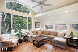 Warm & Inviting room with high volume ceiling