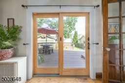 Lots of natural light flood the Dining Room through these Sliding Doors.