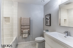 Spa-like Space with Towel Warmer & Linen Closet
