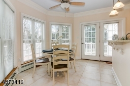 Breakfast area is great for informal meals -- overlooks backyard and deck -- wonderful natural light