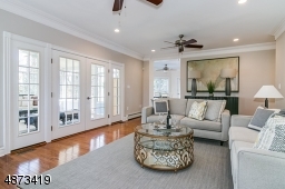 Another view of Family Room, showing glass French doors into Sun Room.