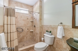Full bath w/ walk-in shower -- provides private ensuite for BR#5 -- located on 1st floor.  In addition, there is a Powder Room on the 1st floor, making this bathroom truly ensuite to BR #5.