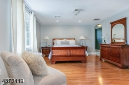 Large MBR w/ hardwood floor; has adjacent Sitting Room, as well as dressing area, leading to WIC and ensuite Master Bath