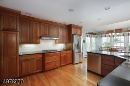 Large updated kitchen with granite countertops