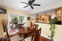 Kitchen w separate dining area opens to deck with view of Huge back yard, patio and Inground Pool