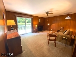 Family room w/fireplace leads to the deck and backyard