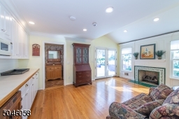 With a separate entrance, the in-law suite offers a private area for your guests. Comfortably designed, this space features a kitchen, full bath, bedroom and living area with a fireplace.