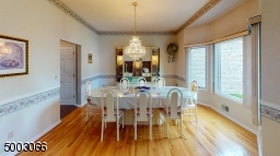 Dining Room with Hardwood Floors and a Bay Window