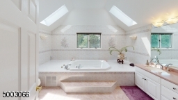 Large Master Bath with Double Vanities and Skylights